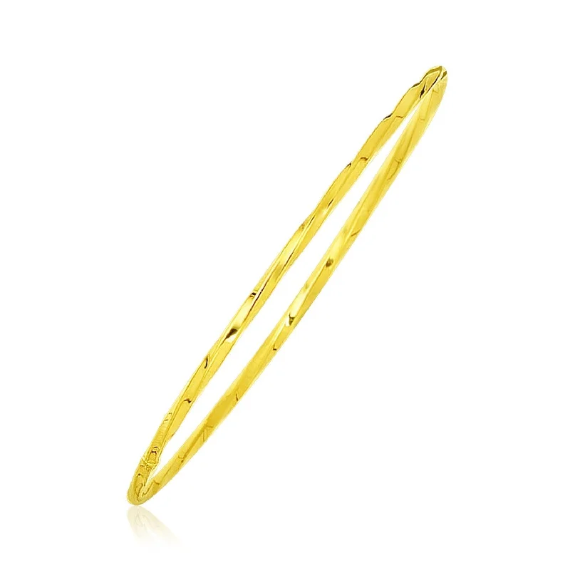 Size: 8'' - 14k Yellow Gold Thin Twisted Shiny Bangle