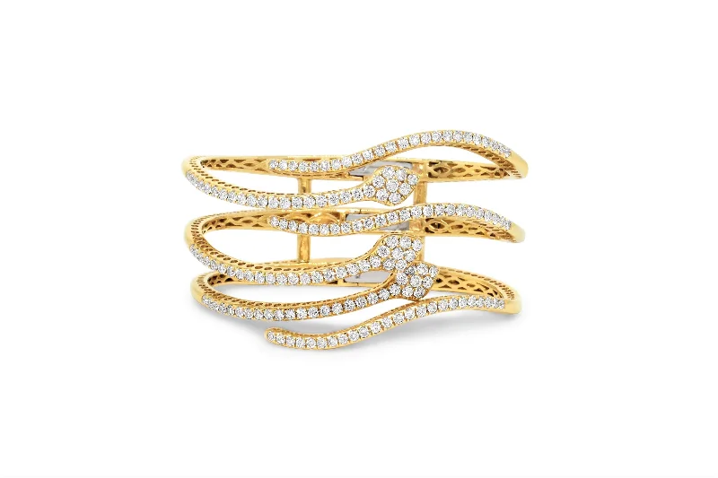 18KT YELLOW GOLD DIAMOND SNAKE BANGLE.